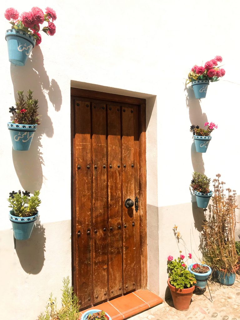 A cover image of a European Mediterranean styled door as the cover of the destination page