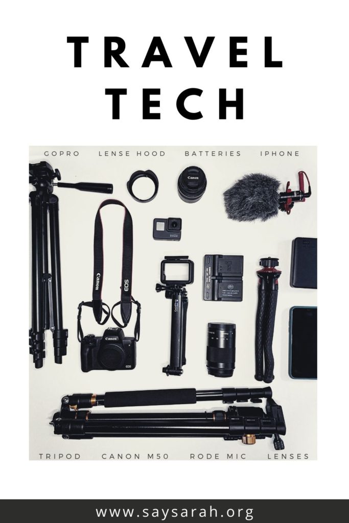 a travel tech flat lay with travel gear from cameras to GoPros to tripods.