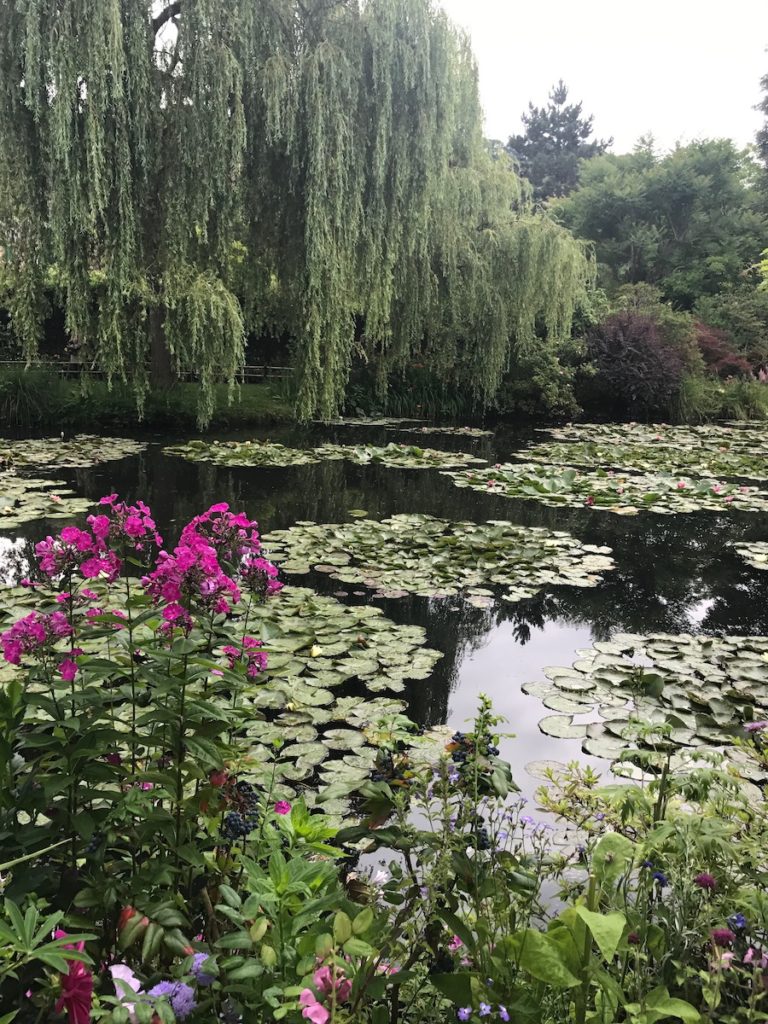 At Monet's Garden in Giverny, France outside of Paris, France looking over the pond with the famous water lilies featured in a lot of Claude Monet's artwork.