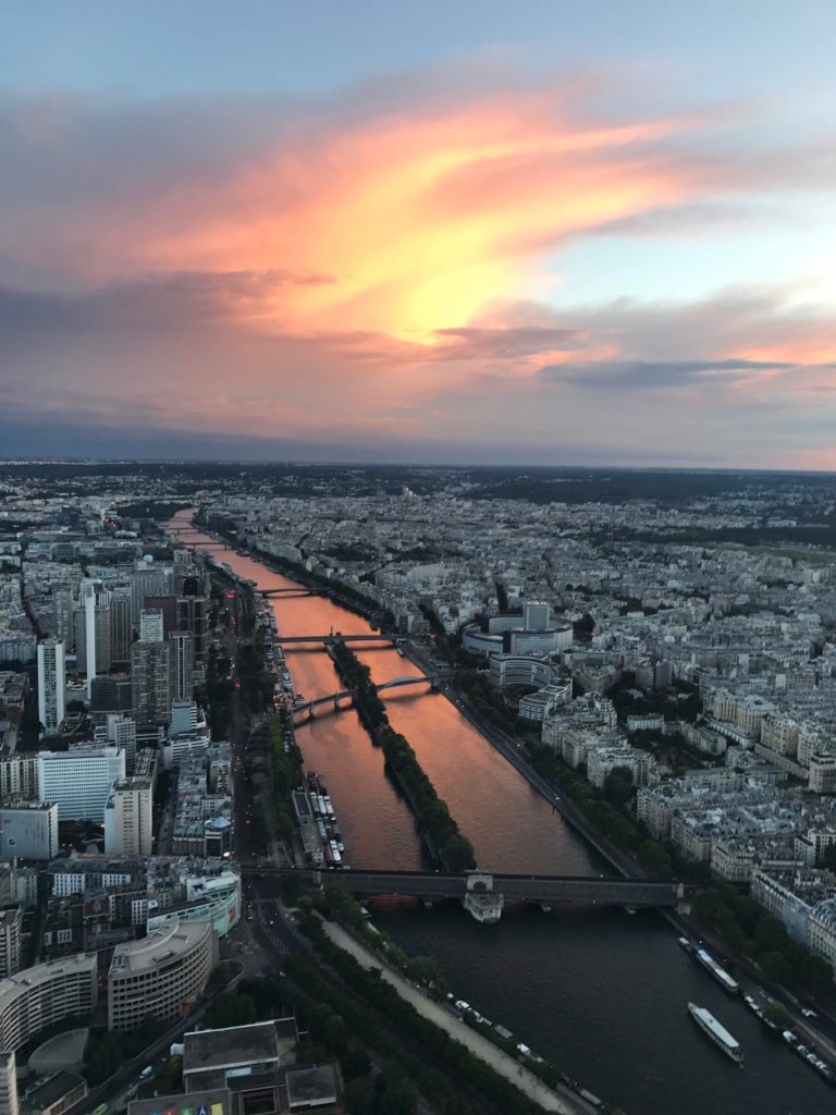 A view of the River Seine from the top of the Eiffel Tower at sunset in Paris, France.