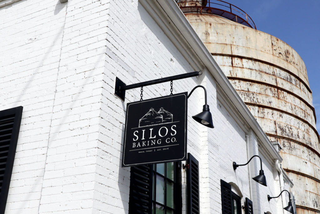 An outdoor image of the Silos Bakery Co at the Magnolia Market in Waco, Texas created by Chip and Joanna Gaines.