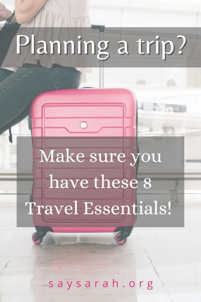 A Pinterest graphic with a suitcase in the background titled "Planning for a trip? Make sure you have these 8 Travel Essentials!"