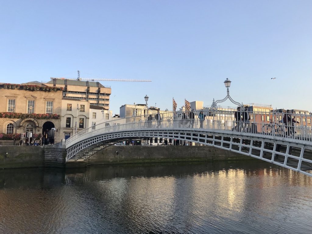 View of Ha'penny Bridge crossing the River Liffey in Dublin, Ireland.