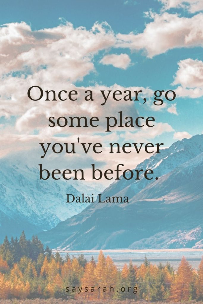 A travel quote that says "Once a year, go some place you've never been before."