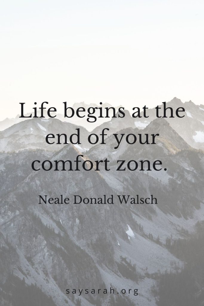 An inspirational travel quote that says "life begins at the end of your comfort zone"