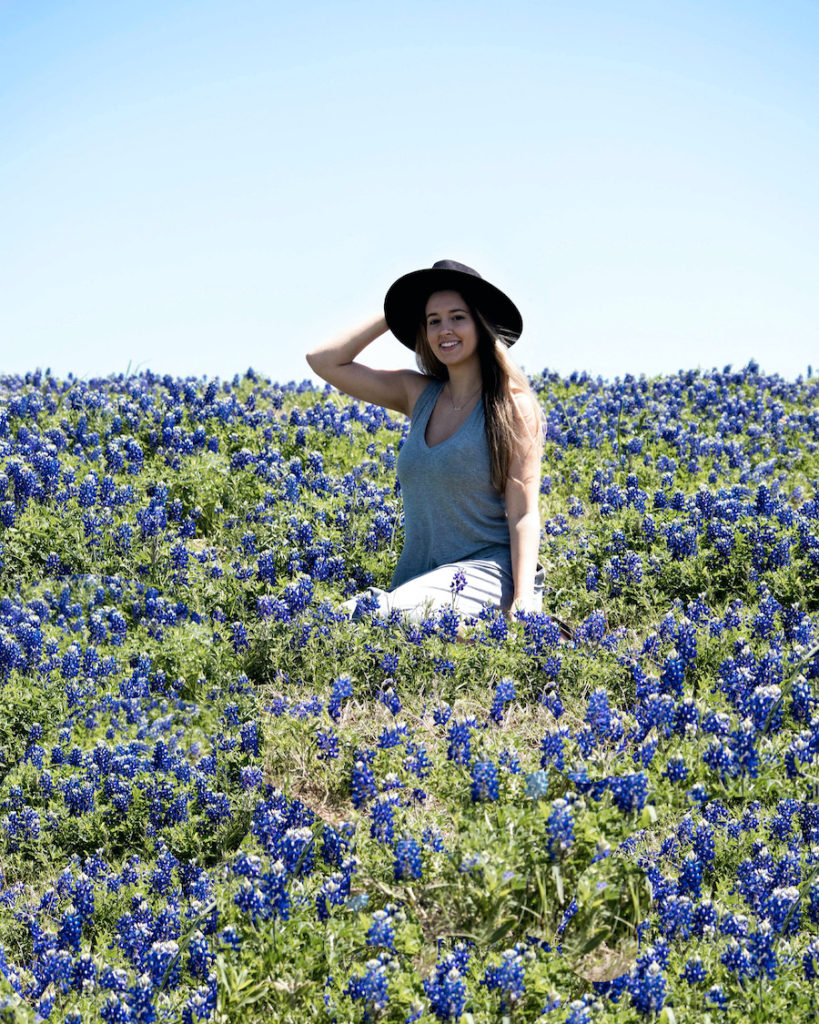 Me sitting in a field of Blue Bonnets outside of Dallas, Texas during a road trip.