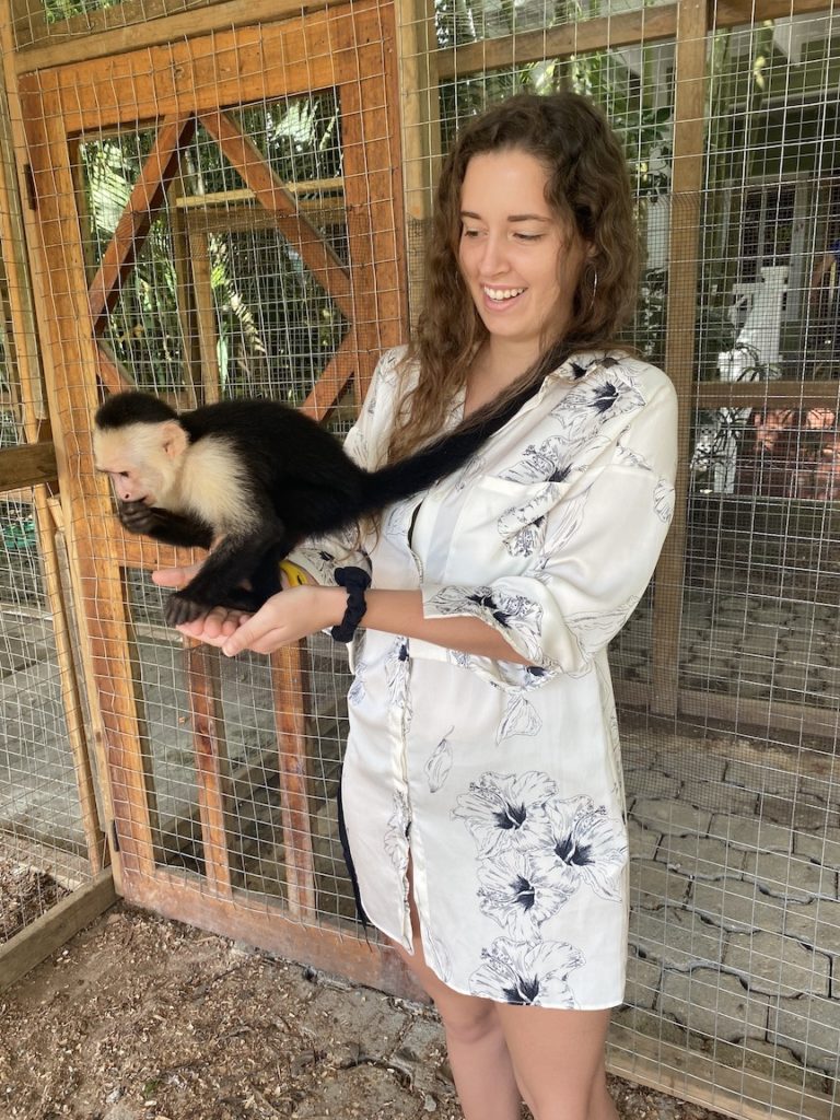 Me at the animal sanctuary in Roatan holding a monkey.