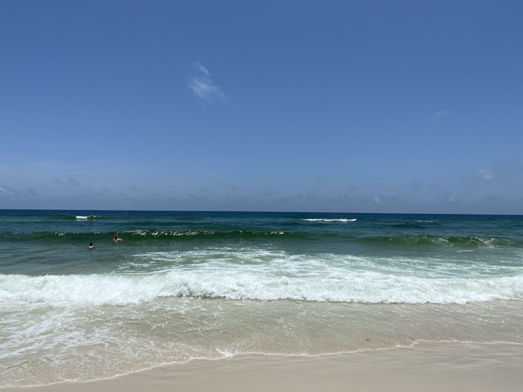 Waves crashing onto the white sands of Pensacola Beach on the Florida panhandle.