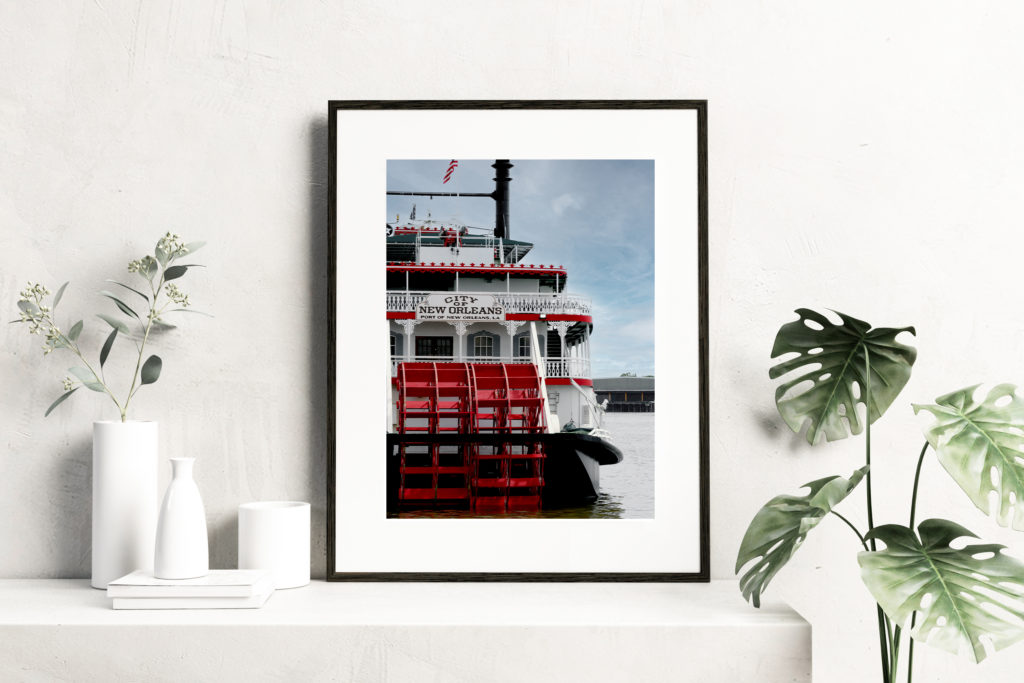 A mockup of a print by Prints by Say Sarah of a New Orleans steamboat on the Mississippi River.
