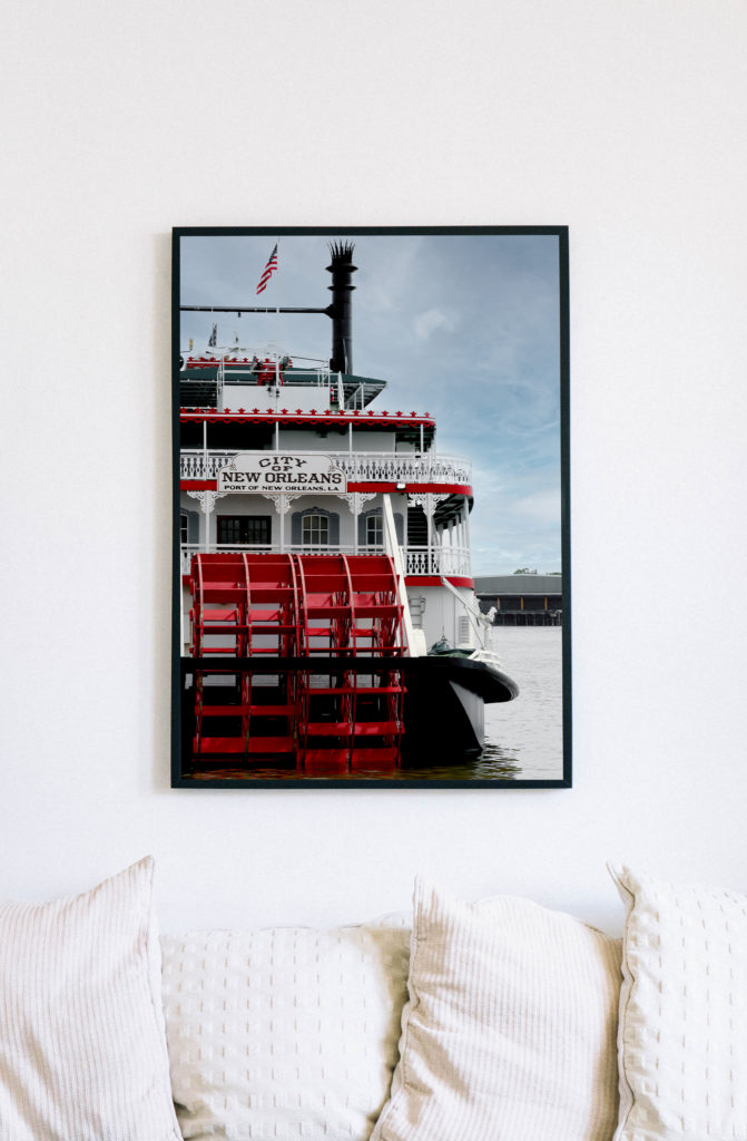 A mockup of a print by Prints by Say Sarah of a New Orleans steamboat on the Mississippi River.
